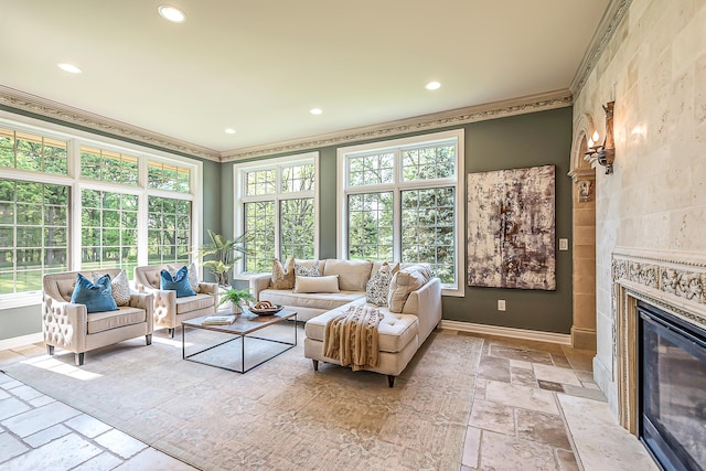 4297 Upper Glade Ct, Ann Arbor, MI 48103 - living room with stone tile floors, ornamental molding, baseboards, recessed lighting, and a tile fireplace