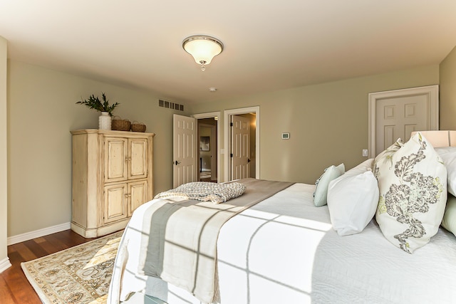 4297 Upper Glade Ct, Ann Arbor, MI 48103 - bedroom featuring dark wood-type flooring and baseboards