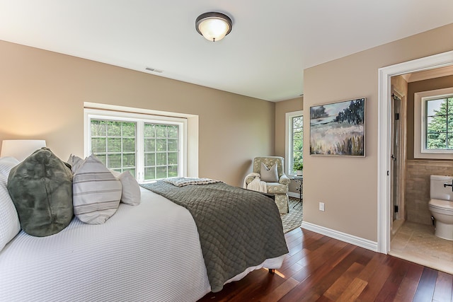 4297 Upper Glade Ct, Ann Arbor, MI 48103 - bedroom featuring hardwood / wood-style floors, baseboards, and connected bathroom