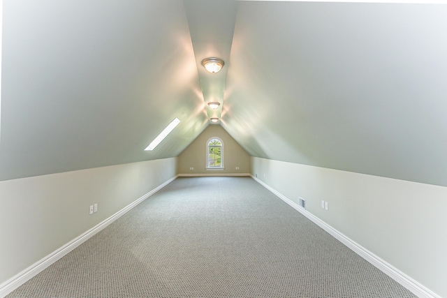 4297 Upper Glade Ct, Ann Arbor, MI 48103 - bonus room featuring baseboards, carpet flooring, and lofted ceiling