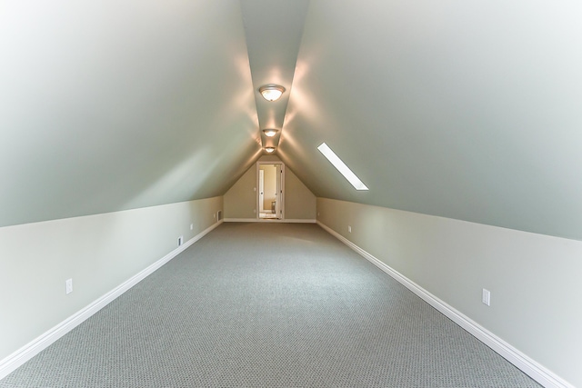 4297 Upper Glade Ct, Ann Arbor, MI 48103 - bonus room with lofted ceiling, light carpet, and baseboards