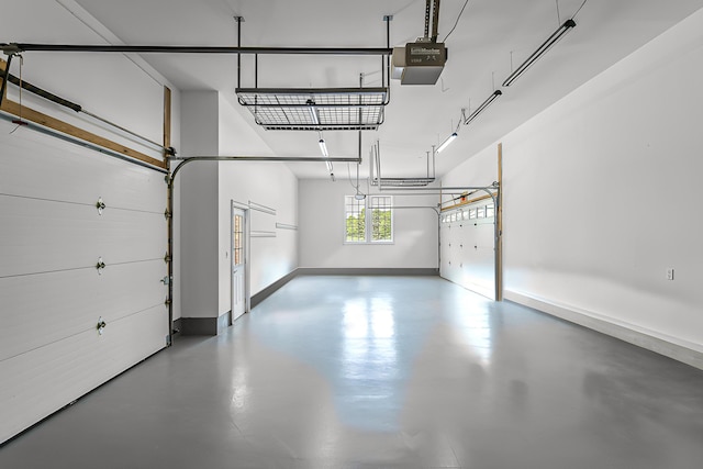 4297 Upper Glade Ct, Ann Arbor, MI 48103 - garage with a garage door opener and baseboards