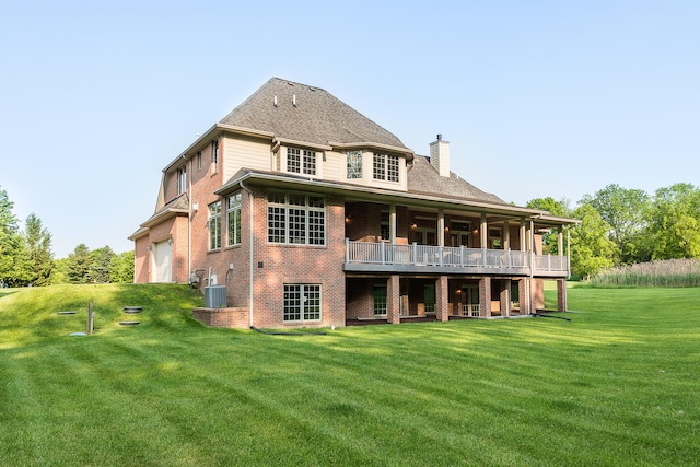 4297 Upper Glade Ct, Ann Arbor, MI 48103 - rear view of house with a chimney, a lawn, a garage, a wooden deck, and brick siding