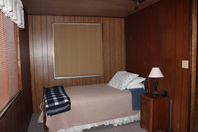 94 E Cherry Creek Rd, Mio, MI 48647 - carpeted bedroom featuring wood walls