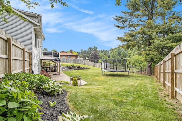 5616 Stoney Brook Rd, Kalamazoo, MI 49009 - view of yard featuring a trampoline and a patio area