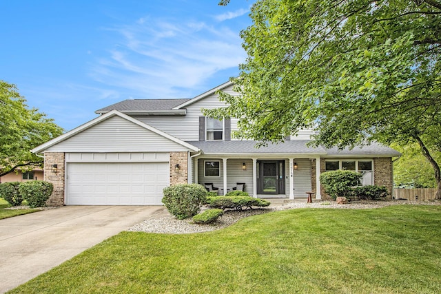 5616 Stoney Brook Rd, Kalamazoo, MI 49009 - traditional-style home featuring brick siding, a garage, driveway, and a shingled roof
