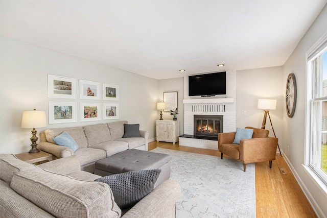 5616 Stoney Brook Rd, Kalamazoo, MI 49009 - living area featuring light wood-style floors, healthy amount of natural light, baseboards, a fireplace, and recessed lighting