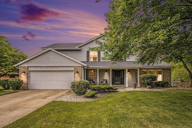 5616 Stoney Brook Rd, Kalamazoo, MI 49009 - traditional-style house with a garage, brick siding, driveway, covered porch, and a shingled roof