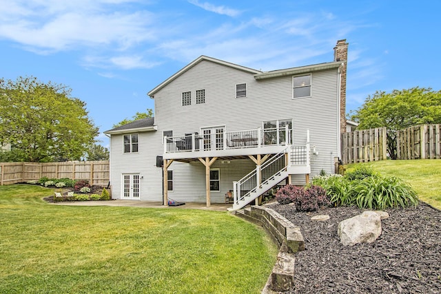 5616 Stoney Brook Rd, Kalamazoo, MI 49009 - rear view of property featuring french doors, a wooden deck, a chimney, stairway, and a patio area