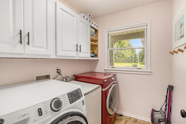5616 Stoney Brook Rd, Kalamazoo, MI 49009 - laundry area with cabinet space, washer and clothes dryer, and baseboards