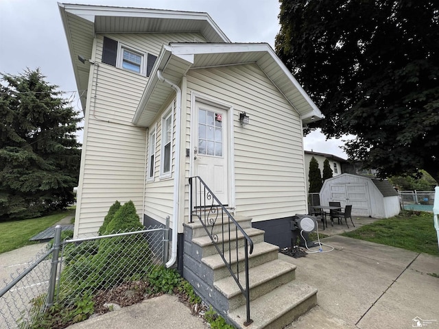 5304 E Dunbar Rd, Monroe, MI 48161 - back of property with entry steps and a patio area
