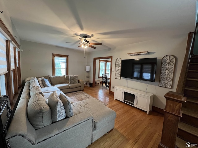 5304 E Dunbar Rd, Monroe, MI 48161 - living room with ceiling fan, stairway, and light wood-type flooring