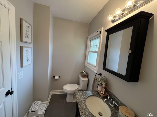 5304 E Dunbar Rd, Monroe, MI 48161 - bathroom featuring vanity, tile patterned floors, toilet, and baseboards
