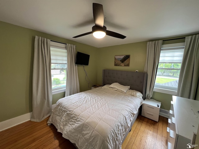 5304 E Dunbar Rd, Monroe, MI 48161 - bedroom featuring baseboards, hardwood / wood-style flooring, and a ceiling fan