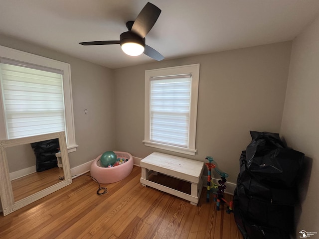 5304 E Dunbar Rd, Monroe, MI 48161 - game room featuring light wood finished floors, a ceiling fan, and baseboards