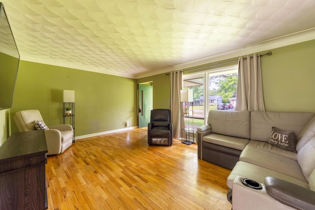 1110 Piccadilly Rd, Kalamazoo, MI 49006 - living area with light wood-type flooring, ornamental molding, and baseboards