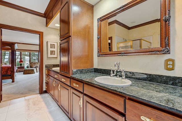 6242 131st Ave, Saugatuck, MI 49453 - ensuite bathroom with ornamental molding, double vanity, a shower stall, and tile patterned flooring