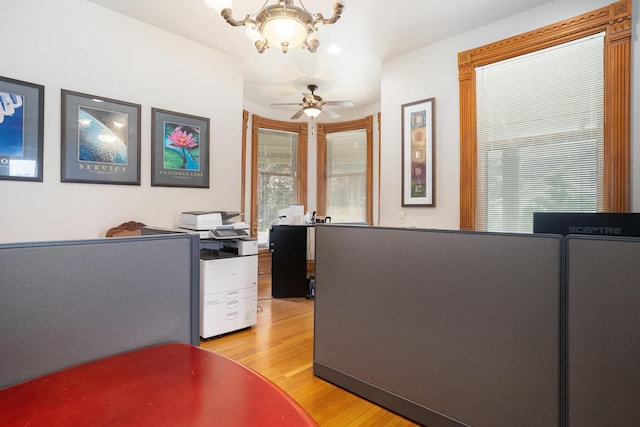 318 Houston Ave, Muskegon, MI 49441 - office space featuring a chandelier, light wood finished floors, and a ceiling fan