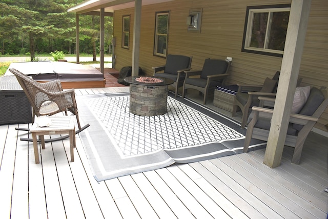 226 N 176th Ave, Walkerville, MI 49459 - wooden terrace featuring a covered hot tub and a fire pit