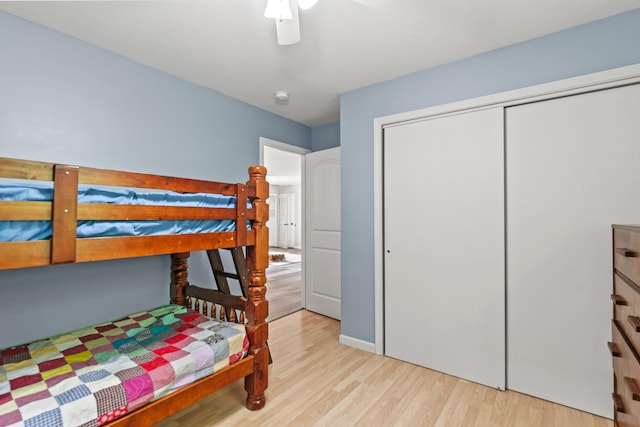 2980 N Old State Rd, Weidman, MI 48893 - bedroom featuring wood finished floors, a closet, and ceiling fan