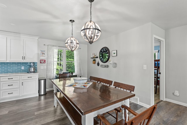2980 N Old State Rd, Weidman, MI 48893 - dining room with a chandelier, dark wood-type flooring, and baseboards