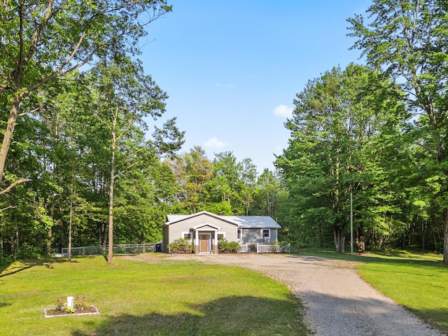 2980 N Old State Rd, Weidman, MI 48893 - view of front facade with dirt driveway and a wooded view