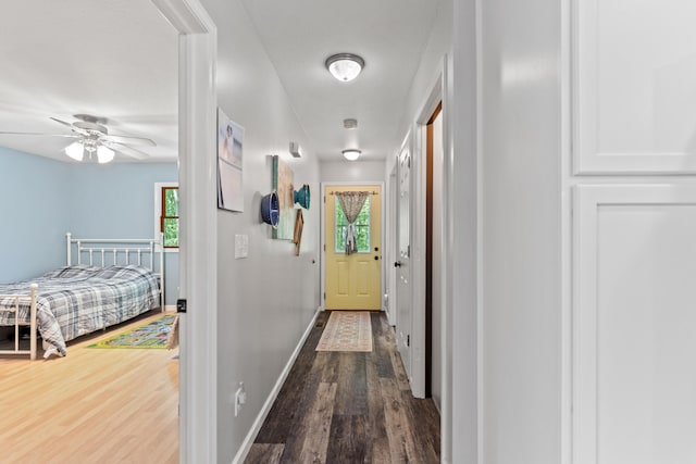 2980 N Old State Rd, Weidman, MI 48893 - corridor featuring wood finished floors and baseboards