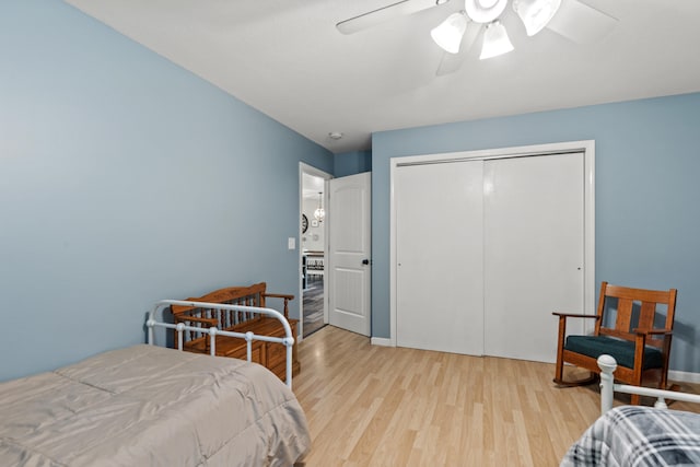 2980 N Old State Rd, Weidman, MI 48893 - bedroom with wood finished floors, a closet, a ceiling fan, and baseboards