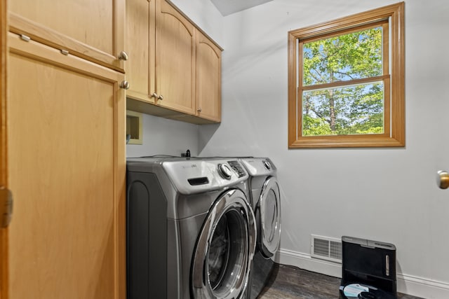 2980 N Old State Rd, Weidman, MI 48893 - laundry area with cabinet space, washing machine and dryer, baseboards, and dark wood finished floors