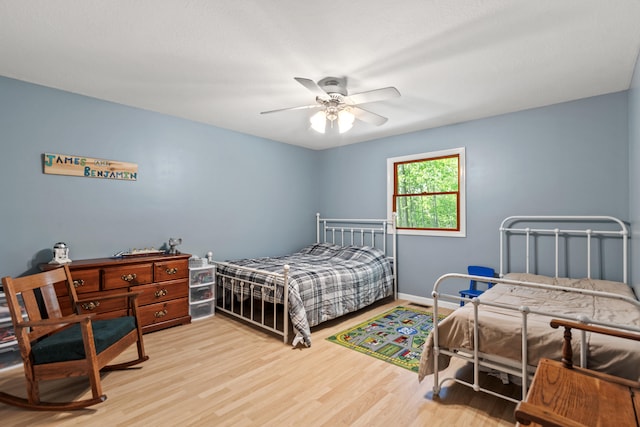 2980 N Old State Rd, Weidman, MI 48893 - bedroom featuring light wood-style flooring, ceiling fan, and baseboards