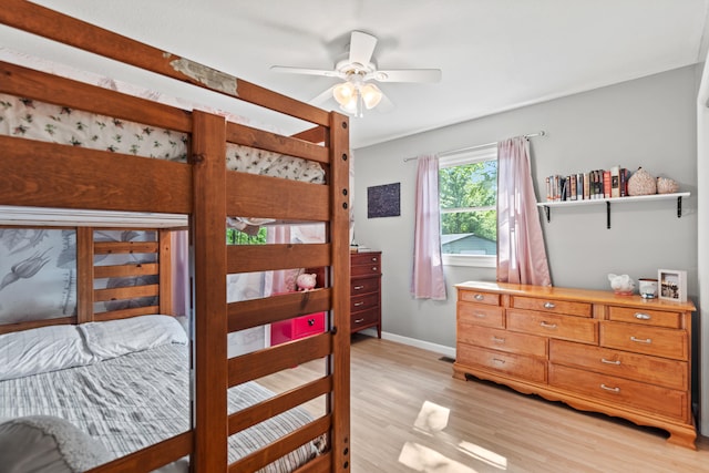 2980 N Old State Rd, Weidman, MI 48893 - bedroom with light wood-style flooring, baseboards, and a ceiling fan