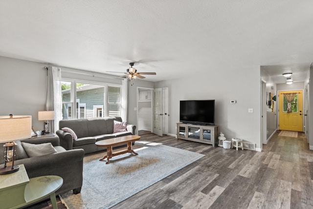 2980 N Old State Rd, Weidman, MI 48893 - living area with a ceiling fan, wood finished floors, and baseboards