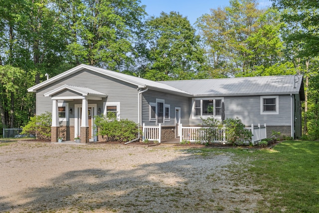 2980 N Old State Rd, Weidman, MI 48893 - view of front of property with metal roof and a front yard