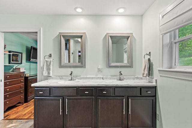 2980 N Old State Rd, Weidman, MI 48893 - full bath with double vanity and wood finished floors