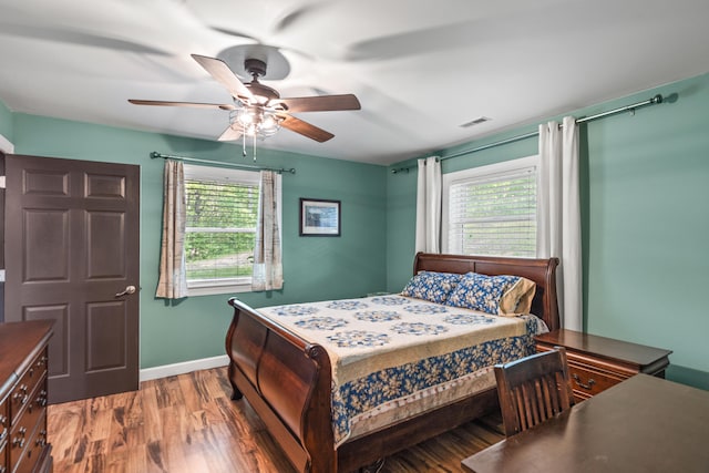 2980 N Old State Rd, Weidman, MI 48893 - bedroom with multiple windows, wood finished floors, baseboards, and ceiling fan