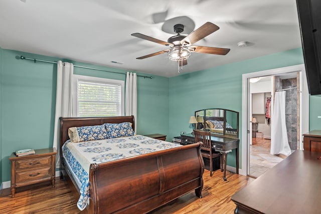 2980 N Old State Rd, Weidman, MI 48893 - bedroom with wood finished floors, baseboards, and ceiling fan