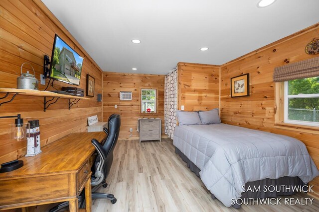 1034 Thompson St SW, Stanton, MI 48888 - bedroom featuring multiple windows, wood walls, recessed lighting, wood finished floors, and a desk