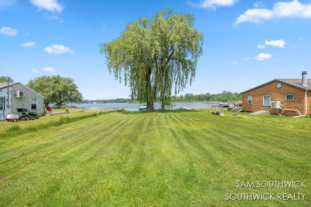 1034 Thompson St SW, Stanton, MI 48888 - view of grassy yard featuring a water view