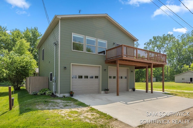 1034 Thompson St SW, Stanton, MI 48888 - view of front of house with a garage, a wooden deck, a front lawn, and driveway