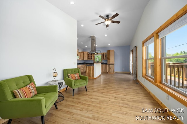 1034 Thompson St SW, Stanton, MI 48888 - sitting room with healthy amount of natural light, light wood finished floors, ceiling fan, recessed lighting, and lofted ceiling