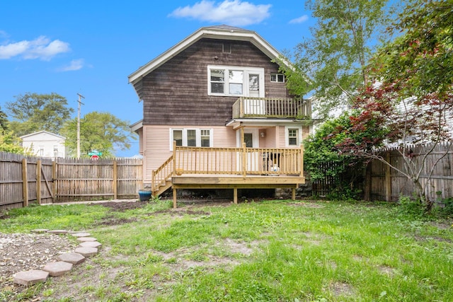 1032 Lafayette Ave NE, Grand Rapids, MI 49503 - rear view of house featuring a wooden deck and a balcony
