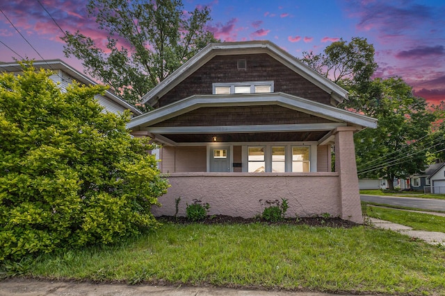 1032 Lafayette Ave NE, Grand Rapids, MI 49503 - view of front of home with a porch and a front lawn