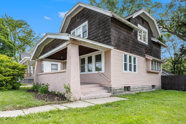 1032 Lafayette Ave NE, Grand Rapids, MI 49503 - view of property exterior featuring a gambrel roof and a porch