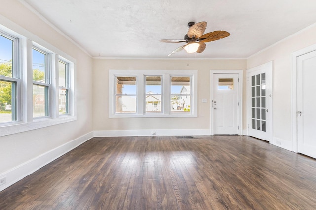 1032 Lafayette Ave NE, Grand Rapids, MI 49503 - unfurnished living room featuring dark wood-style flooring, ornamental molding, baseboards, and ceiling fan