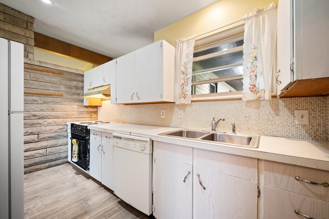 275 Benjamin St, Benton Harbor, MI 49022 - kitchen featuring white appliances, a sink, light countertops, under cabinet range hood, and decorative backsplash