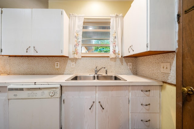 275 Benjamin St, Benton Harbor, MI 49022 - kitchen with dishwasher, a sink, light countertops, white cabinets, and backsplash