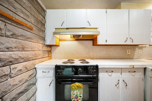 275 Benjamin St, Benton Harbor, MI 49022 - kitchen featuring under cabinet range hood, light countertops, electric range, tasteful backsplash, and white cabinetry