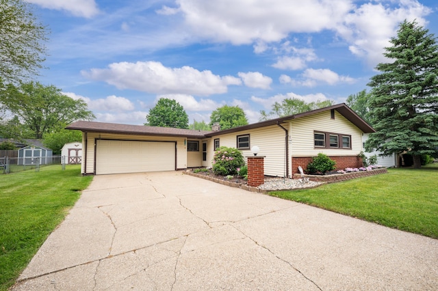 275 Benjamin St, Benton Harbor, MI 49022 - ranch-style home with an attached garage, concrete driveway, brick siding, and a chimney