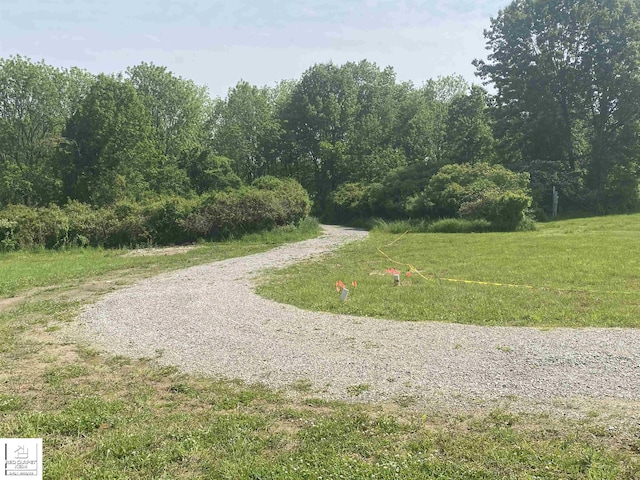 3801 Sutton Rd, Metamora, MI 48455 - surrounding community with a view of trees and a lawn