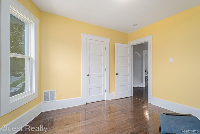 2499 Baldwin St, Detroit, MI 48214 - unfurnished bedroom featuring wood finished floors and baseboards